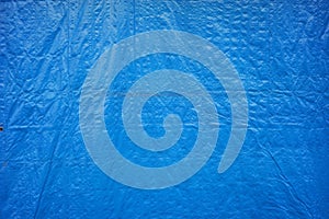 Blue tarp texture for design material or photo background. a tool to protect goods from damage