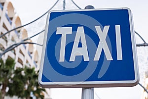 Blue Taxi Sign in the city centre