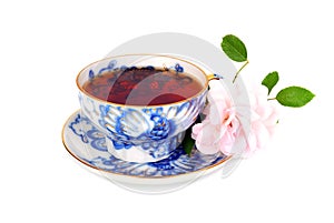Blue tea cup and pink rose
