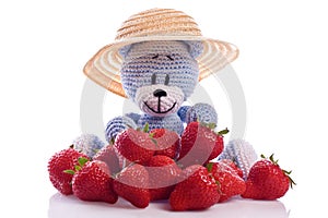 Blue teddy bear with strawberries