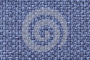Blue textile background with checkered pattern, closeup. Structure of the fabric macro.