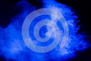 Blue theatrical smoke on stage during a performance or show