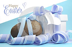 Blue theme Happy Easter chocolate egg and gift box with stripe ribbon