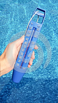 Blue thermometer in the pool