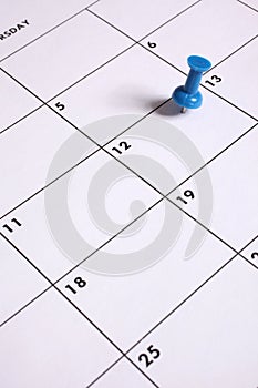 Blue Thumb Tack on Calendar