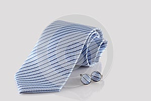 Blue tie with cuff links