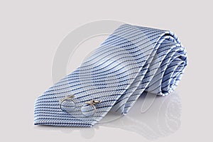 Blue tie with cuff links