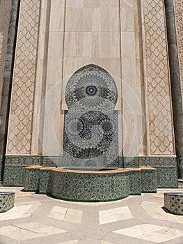 an blue tiled ablution fountain at hassan ii mosque in casablanca