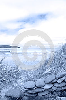 Blue toned stone wall shelter on a beautiful beach