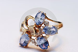 Blue topaz on golden rings