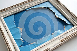 Blue torn paper hole frame