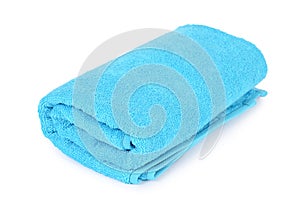 Blue towel isolated on white background photo