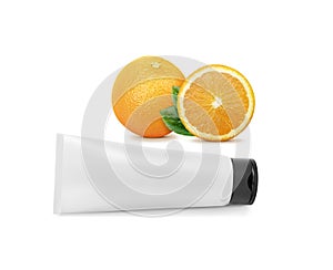 Blue towel on white backgroundPlastic cosmetic tube and fresh orange with isolated on white background