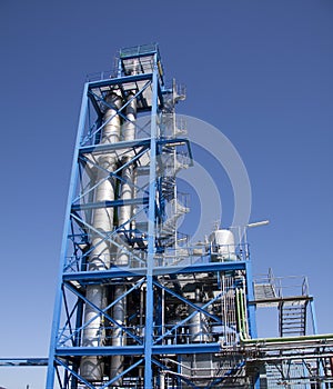 Blue tower with industial pipes