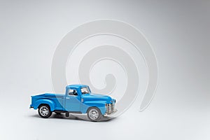 blue toy car pickup on white background