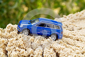 Blue toy car rises up