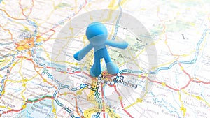 A blue toy man pin stuck in Bratislava on a map of Slovakia