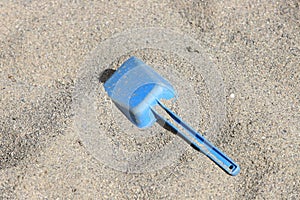 Blue toy spade