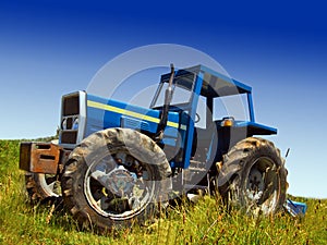 Blue tractor in field