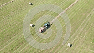 Blue Tractor Hay Bales Aerial View