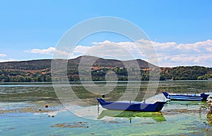 Blue traditional old wooden fishing boats, Greece