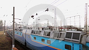 Blue train. Diesel locomotive. Empty passenger vehicle was going. Old diesel electric