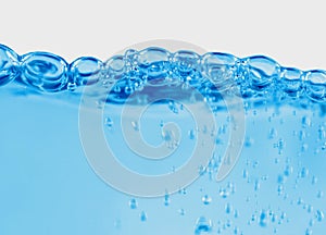 blue transparent water wave splash abstract with water bubbles on white