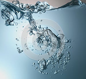 blue transparent water wave splash abstract with water bubbles on white