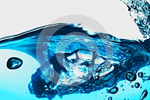 blue transparent water wave splash abstract with water bubbles on white