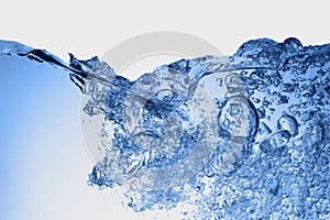 blue transparent water wave splash abstract with water bubbles on white