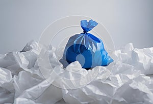 Blue trash bag on a white surface, AI-generated.