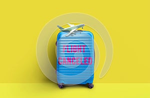 Blue travel suitcase, Concept of Caneled trip to risk places COVID-19