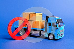 A blue truck loaded with boxes and a red symbol NO. Embargo trade wars. Restriction on importation, ban on export of dual-use