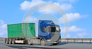 Blue truck moves green container