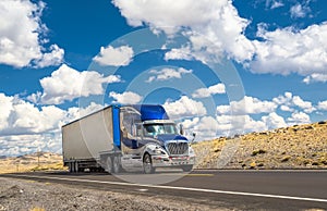 Blue truck moving on a highway