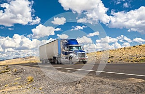 Blue truck moving on a highway