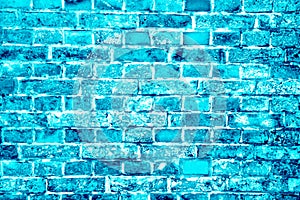 Blue turquoise or cyan brick wall painted with different tones and hues as seamless pattern texture background
