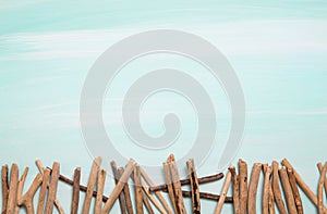 Blue or turquoise oceanic background with a fence of driftwood f photo