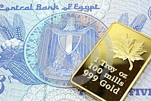 A blue twenty five piastre note from Egypt with a gold bar in macro