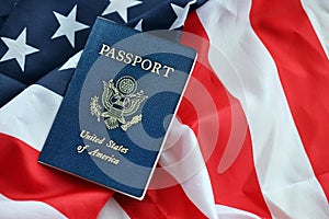 Blue United States of America passport on national flag background close up