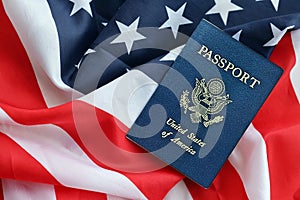 Blue United States of America passport on national flag background close up
