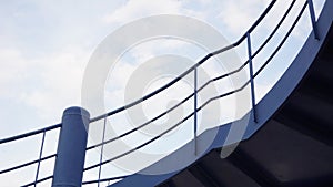 Blue urban stairs against sky background with clouds