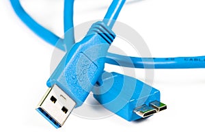 Blue usb 3.0 cable with micro B connector isolated on white background.