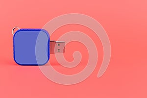 Blue USB memory stick on red background