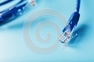Blue UTP Internet Cable Isolated on a blue background Ethernet Cord