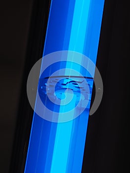 Blue UV light source in an industrial pipe arrangement