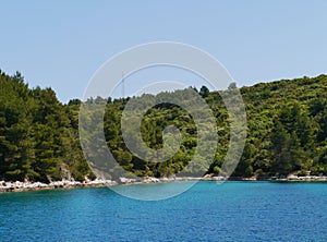 A blue vessel in a bay in Croatia