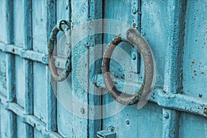 blue vintage metal door with round knobs, decor element