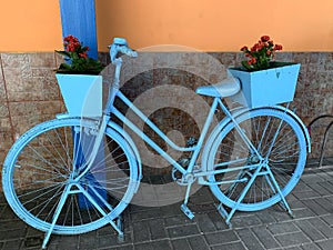 Old vintage bicycle blue color with flowers