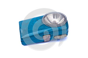 Blue vintage old flashlight on white background